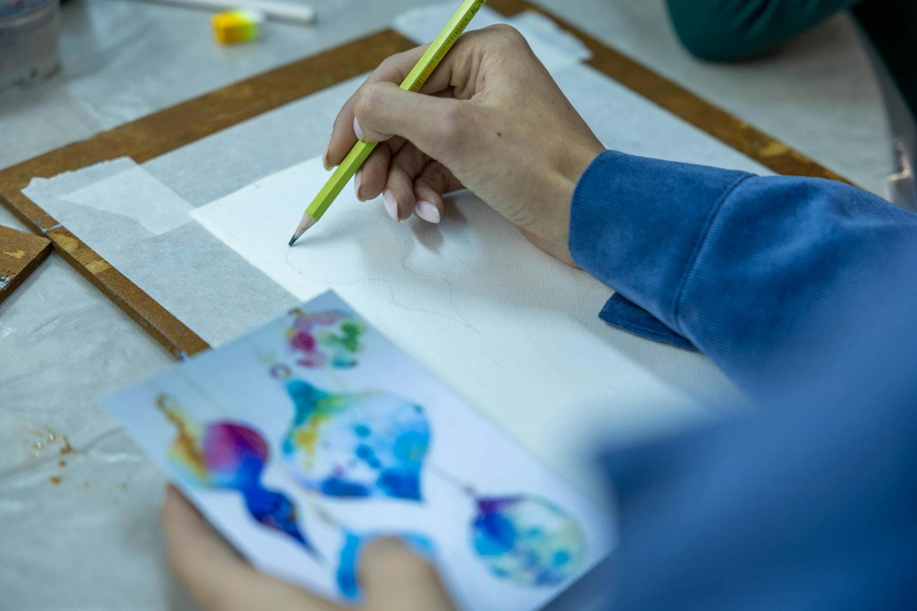 Hand holding a smartphone with AI chatbot app, emphasizing artificial intelligence and technology.