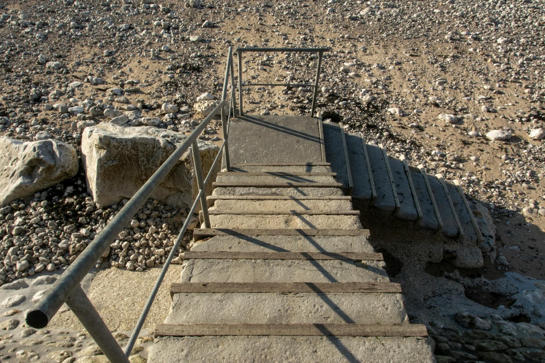 Two colleagues brainstorm ideas on a whiteboard during a creative strategy session.