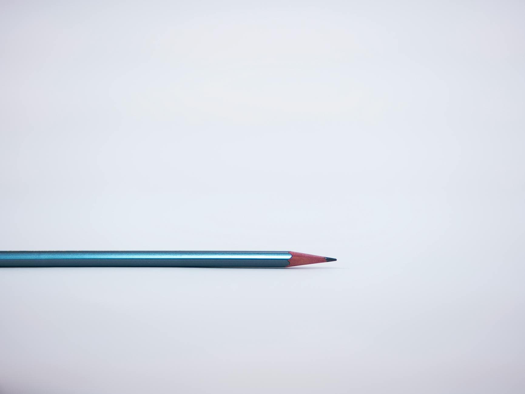 Person using a bank card for contactless payment at a modern checkout counter.