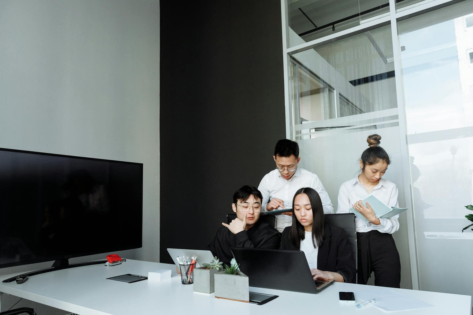 A tablet with a financial website open, alongside a white keyboard and mouse. Ideal for tech-theme stock images.